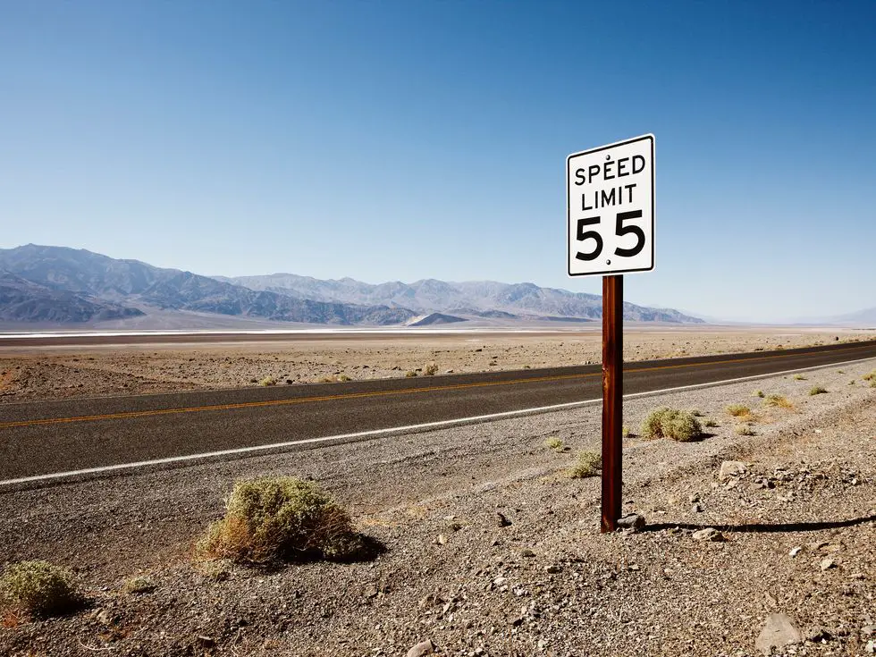 Roadside sign in desert landscape