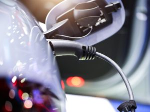 A new level of cooperation between power companies could help string together a more viable electric vehicle charging network.