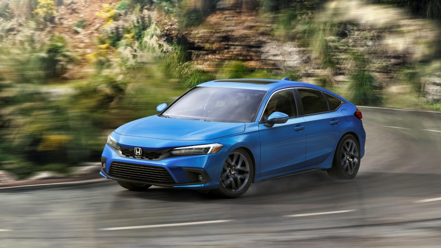 The 2022 Civic Hatchback features a sweeping shape.