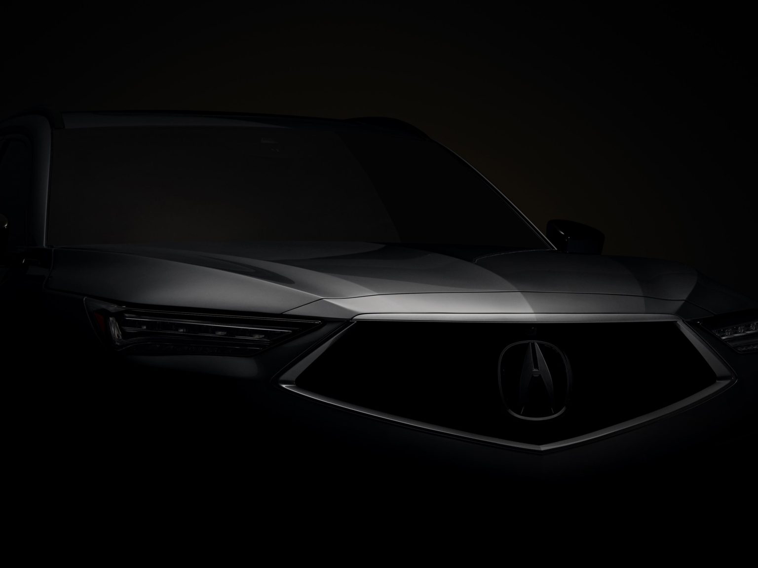 Acura has teased the forthcoming MDX with this photo.