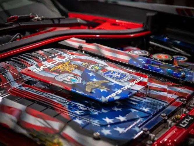 The engine bay is decorated with images of the American flag.