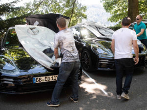 Porsche has shown off lightly camouflaged versions of the new Panamera ahead of its debut.