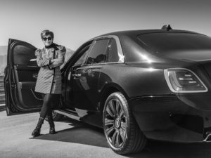 Kris Jenner stands next to her new 2021 Rolls-Royce Ghost.