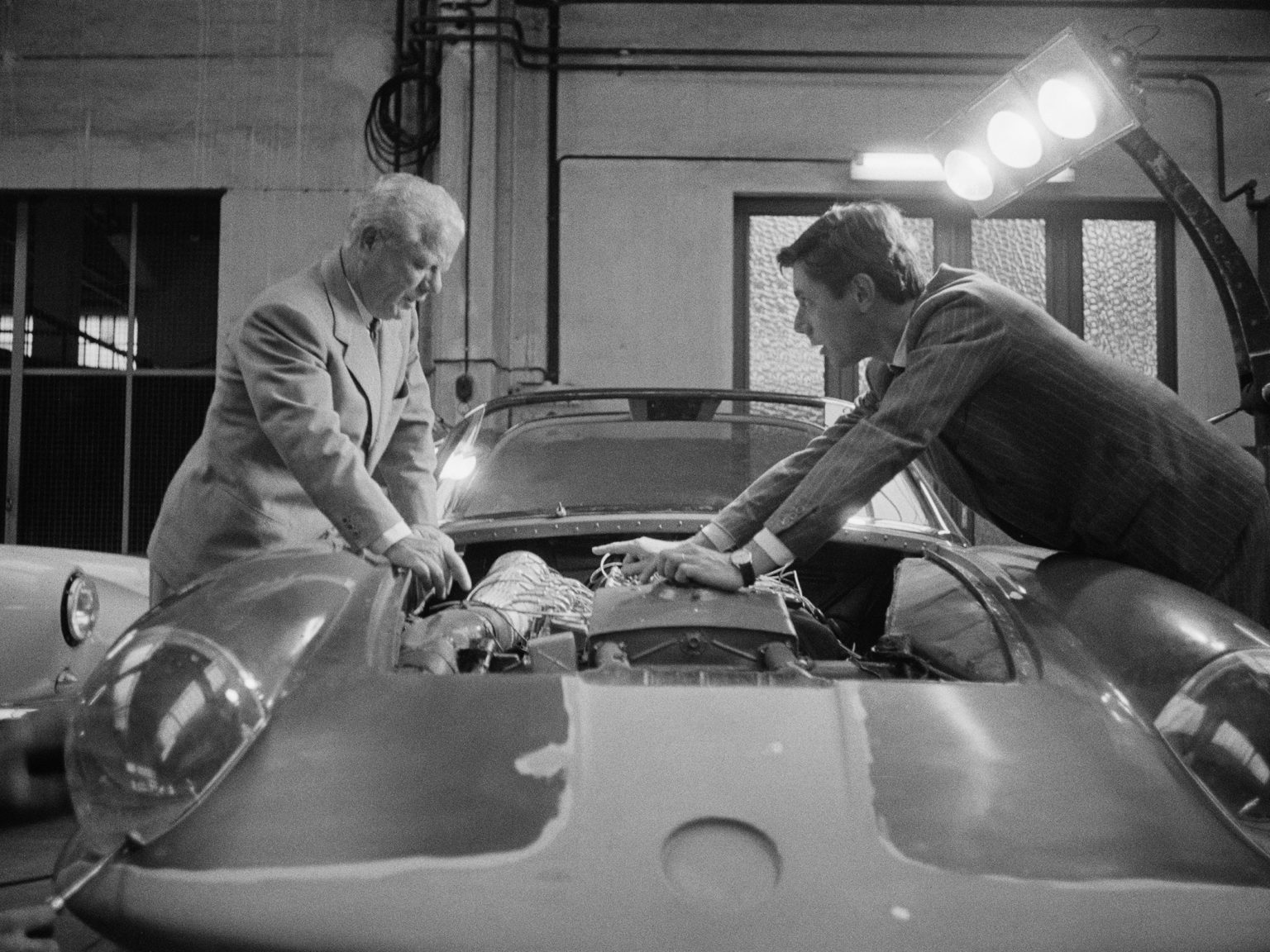 Italian car designers Battista Farina (1893 - 1966, left) and his son Sergio (1926 - 2012), of the Pininfarina car design and coachbuilding firm, Italy, 28th September 1956.