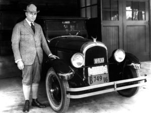 Walter P. Chrysler stands next to his1924 Chrysler Six, the first car bearing the Chrysler name.