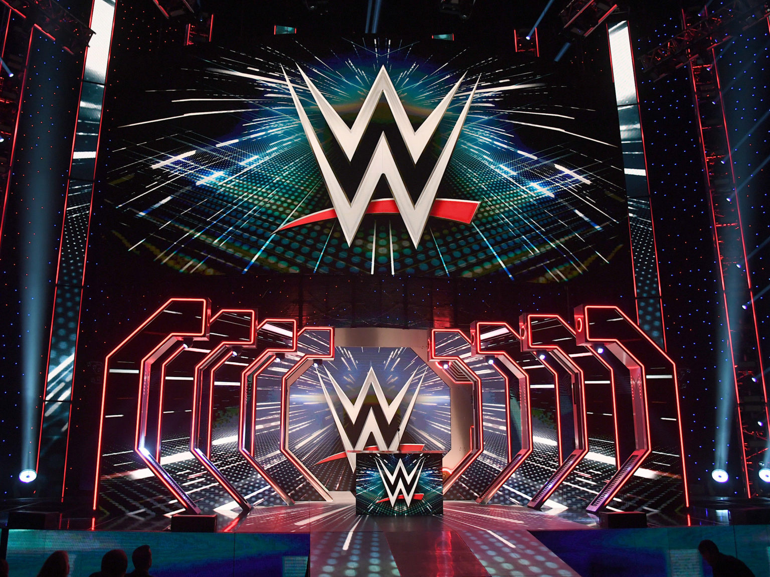 WWE logos are shown on screens before a WWE news conference at T-Mobile Arena on October 11, 2019 in Las Vegas, Nevada.