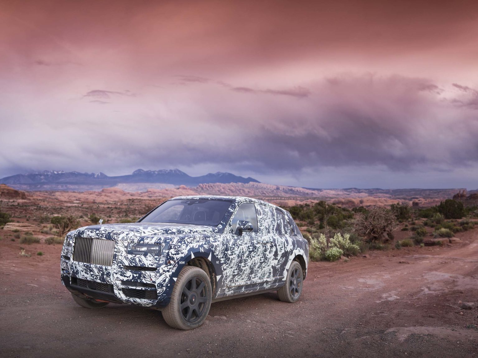 The Rolls-Royce Cullinan, seen here in disguise during testing, is just one of the models featured in the series.