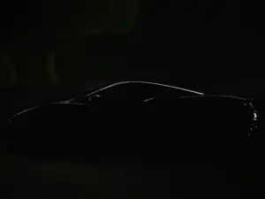 McLaren has released a teaser photo and video showing off its new hybrid car.