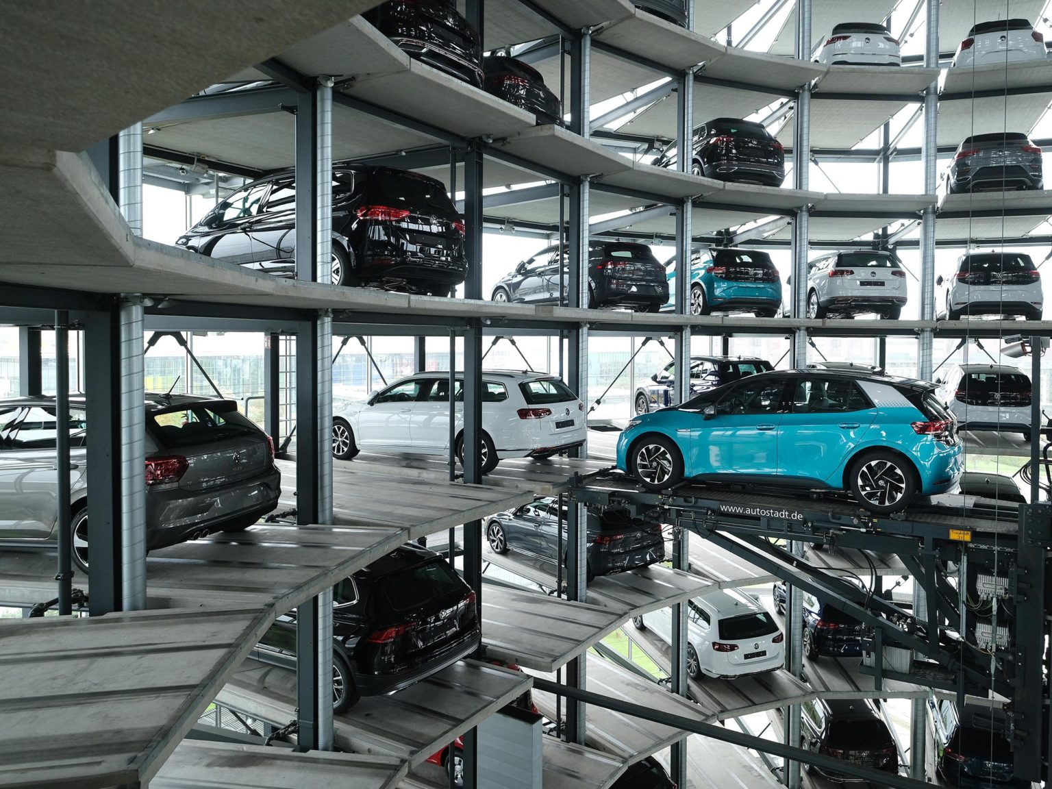 A Volkswagen ID.3 electric car stands on an elevator platform inside one of the twin towers used as storage at the Autostadt promotional facility next to the Volkswagen factory on October 26, 2020 in Wolfsburg, Germany. The facility contains a multi-brand museum.