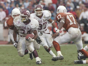 Running back Dante Hall of the Texas A&M Aggies runs down the field during a game against the Texas Longhorns at Texas Memorial Stadium in Austin, Texas. Texas won the game 51-15.