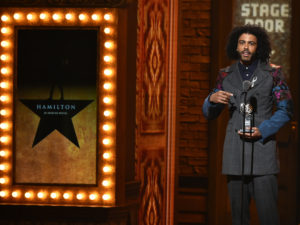 Actor Daveed Diggs accepts the award onstage for Best Performance by an Actor in a Featured Role in a Musical for his work in Hamilton during the 70th Annual Tony Awards at The Beacon Theatre on June 12, 2016 in New York City.
