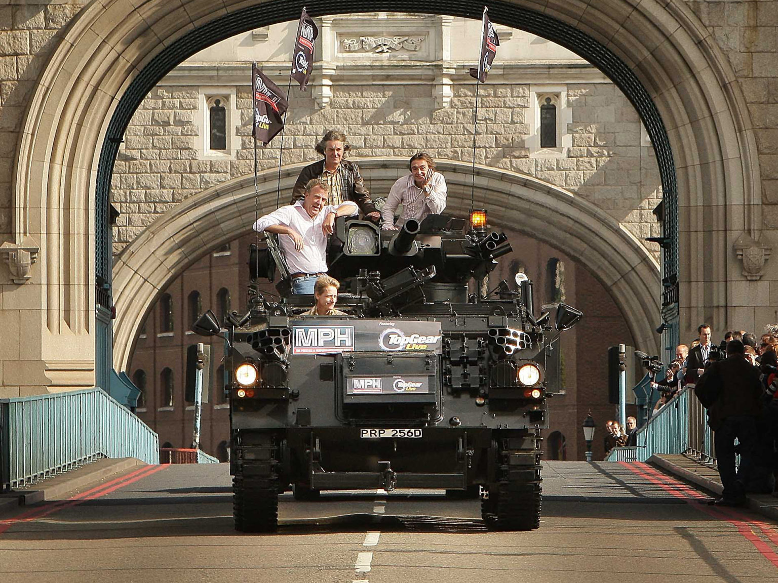 Television presenters Jeremy Clarkson, Richard Hammond and James May cross Tower Bridge on a military vehicle on September 1, 2008 in London. The trio took part in the stunt to promote a live travelling show version of their popular TV series Top Gear.
