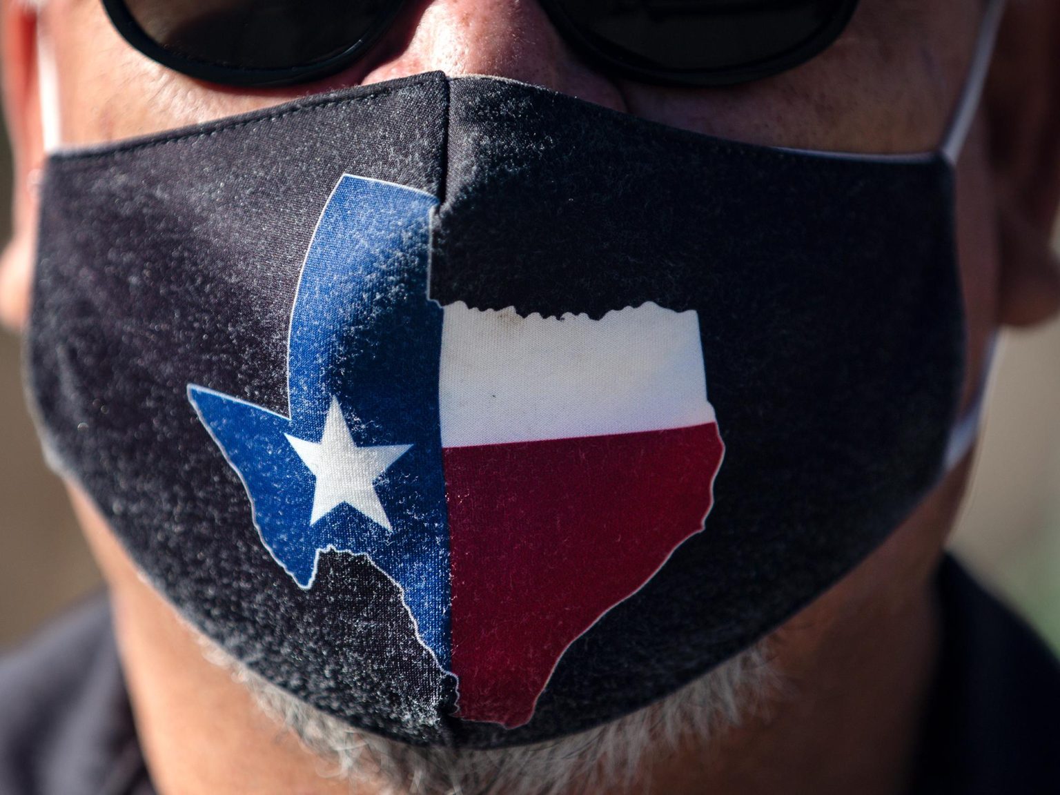 San Jose Hotel engineering manager Rocky Ontiveros, 60, wears a Texas mask on March 3, 2021 in Austin, Texas. Gov. Greg Abbott announced a new executive order that will end the statewide mask mandate and allow businesses to reopen at 100 percent capacity on March 10, 2021.